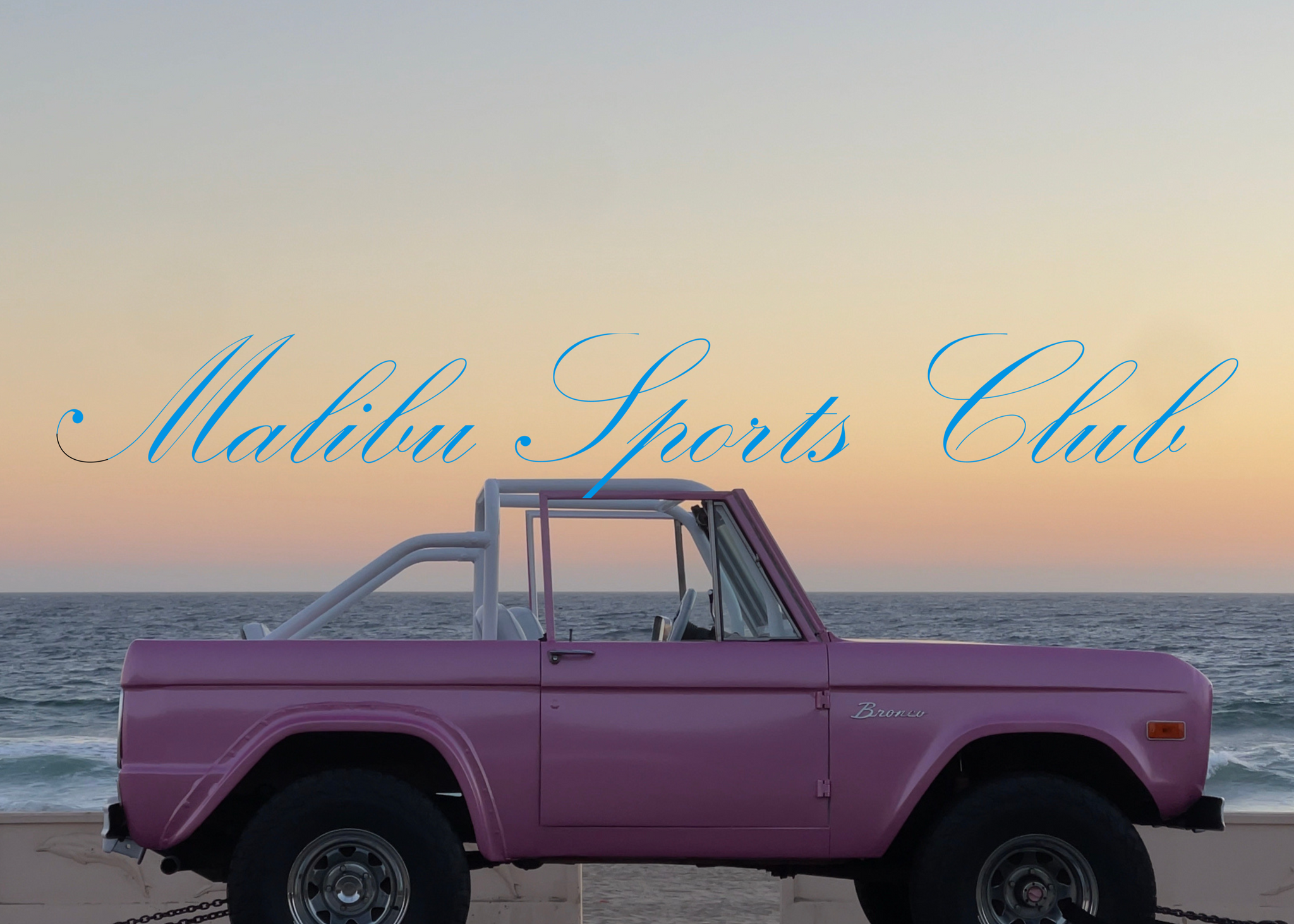 Pink vintage truck on a beach with 'Malibu Sports Club' text